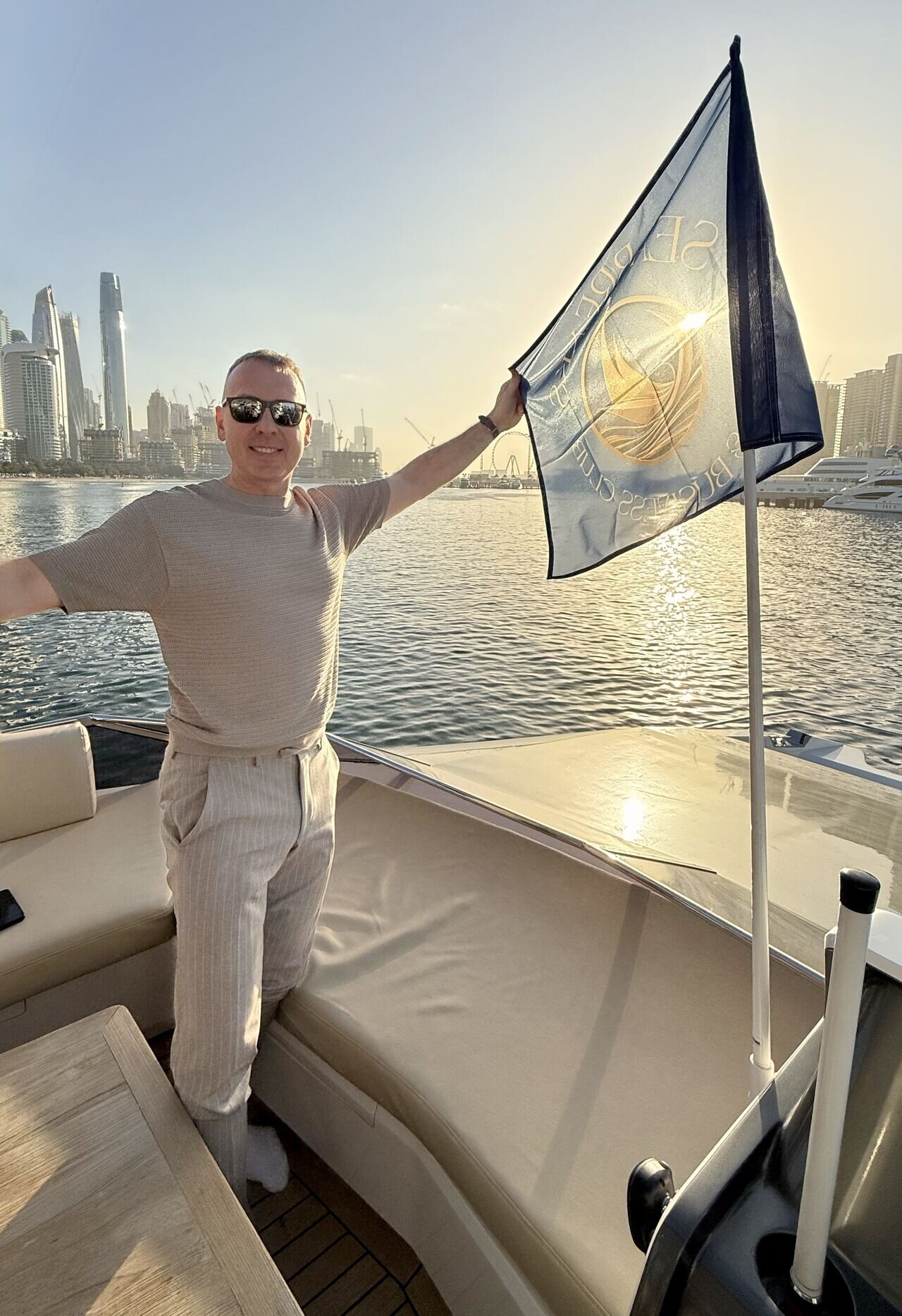 Vlado Houba in Dubai with Sea-Breaks Business Club flag